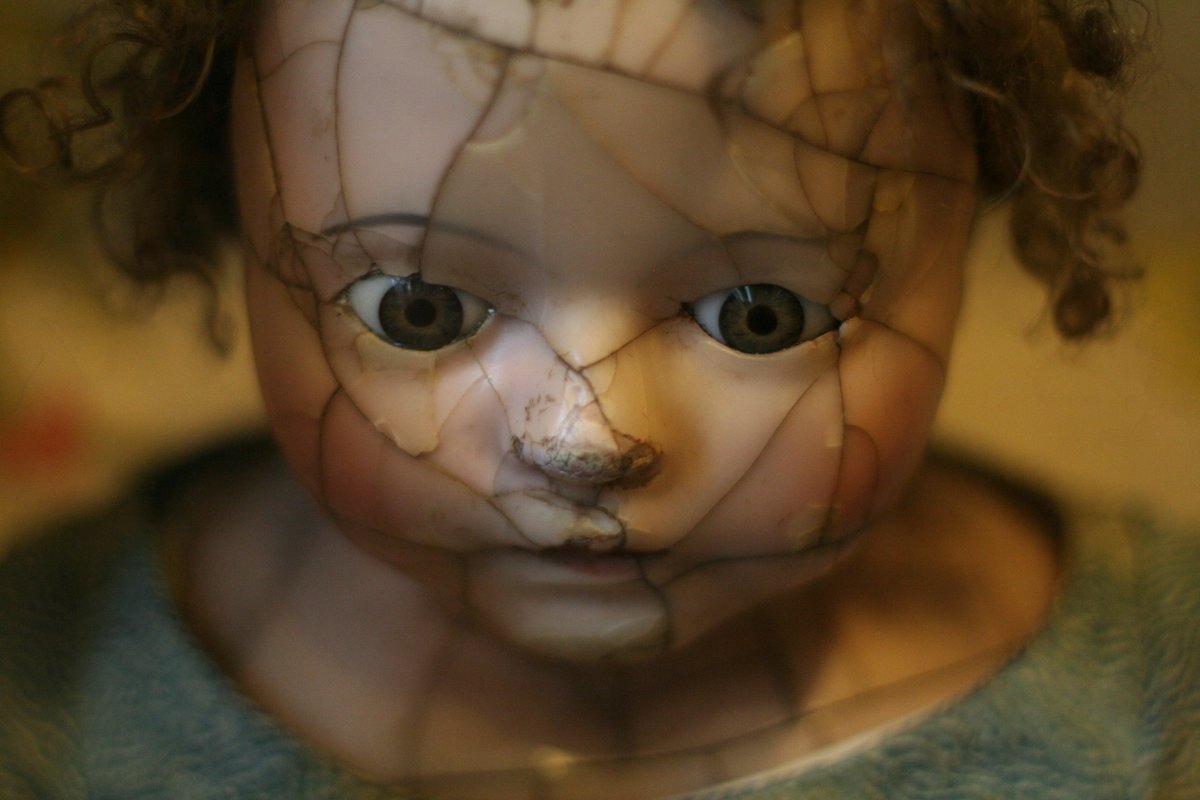 porcelain doll with cracked face